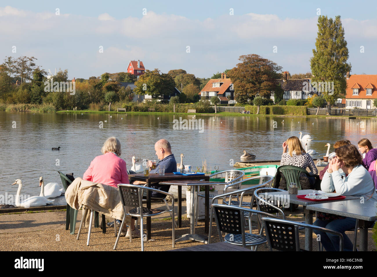 People having tea on a sunny day at Thorpeness Meare, Thorpeness village, Aldeburgh Suffolk England UK Stock Photo
