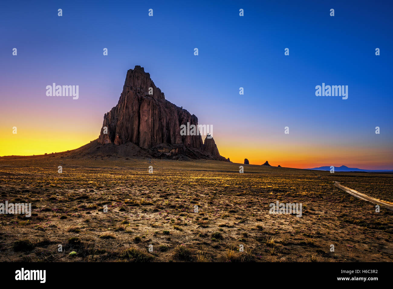 Sunset above Shiprock in New Mexico Stock Photo