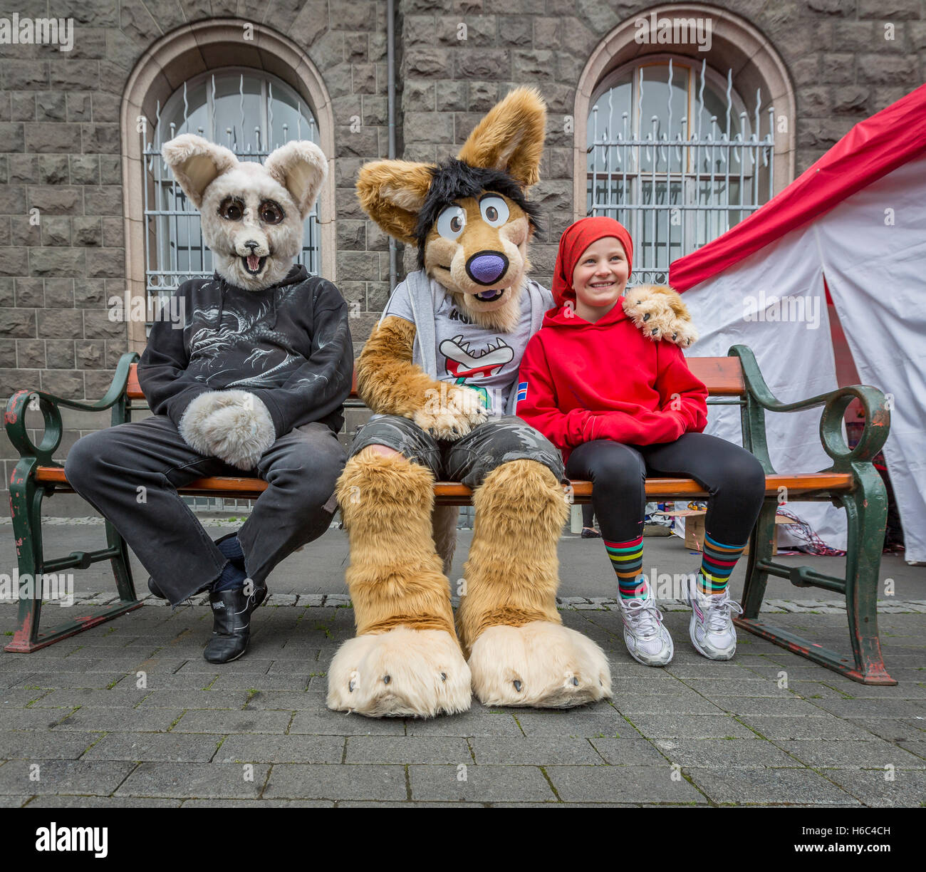 Young girl with people in animal costumes, Independence day, Reykjavik, Iceland Stock Photo