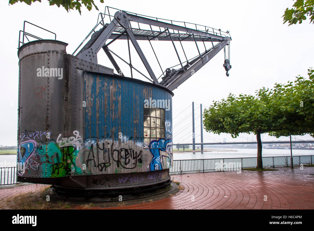 Europe, Germany, Duesseldorf, old crane on the bank of the river Rhine near the state parliament. Stock Photo