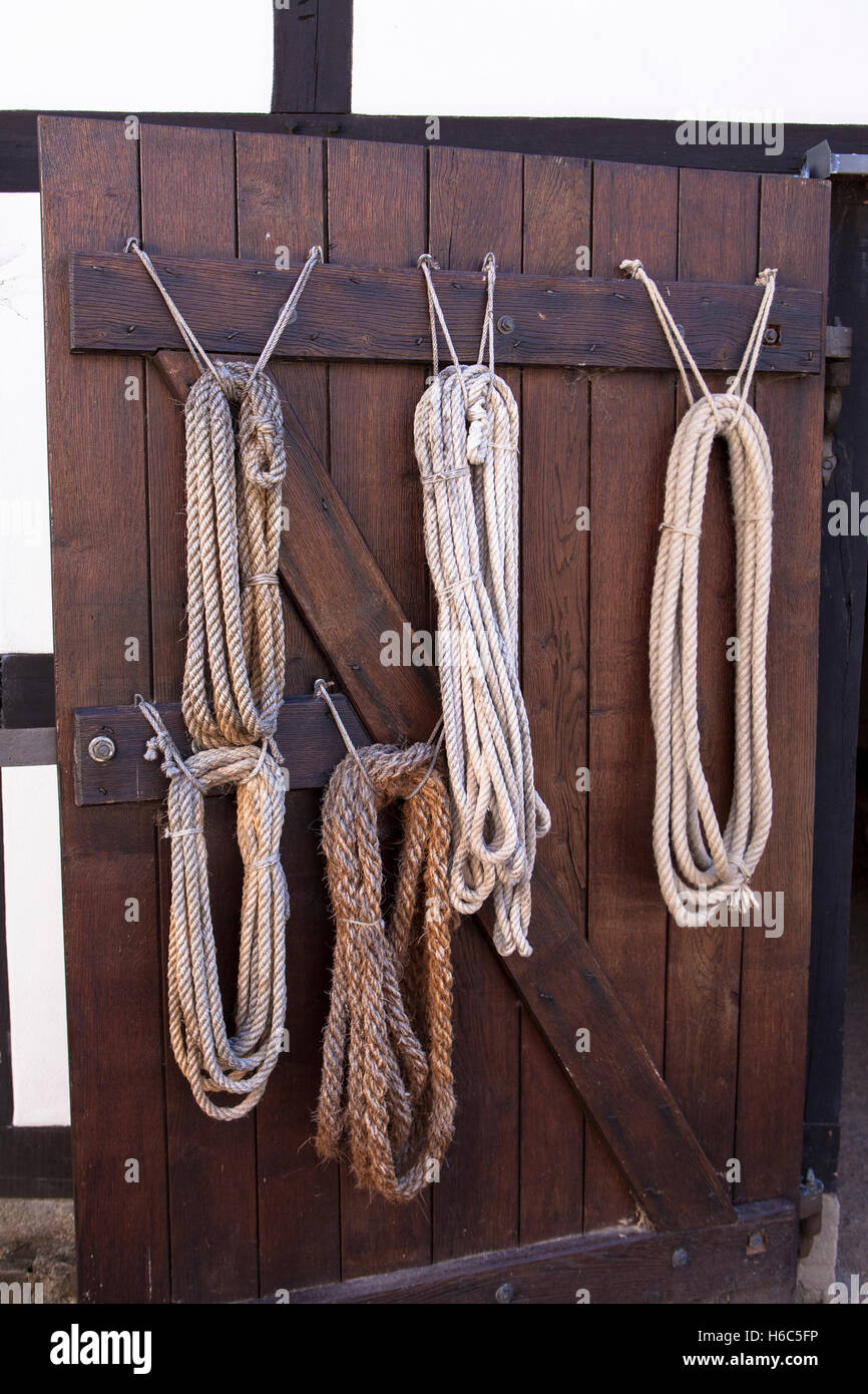 Germany, Hagen, Hagen Open-air Museum, ropes hanging on the door of the old ropery. Stock Photo