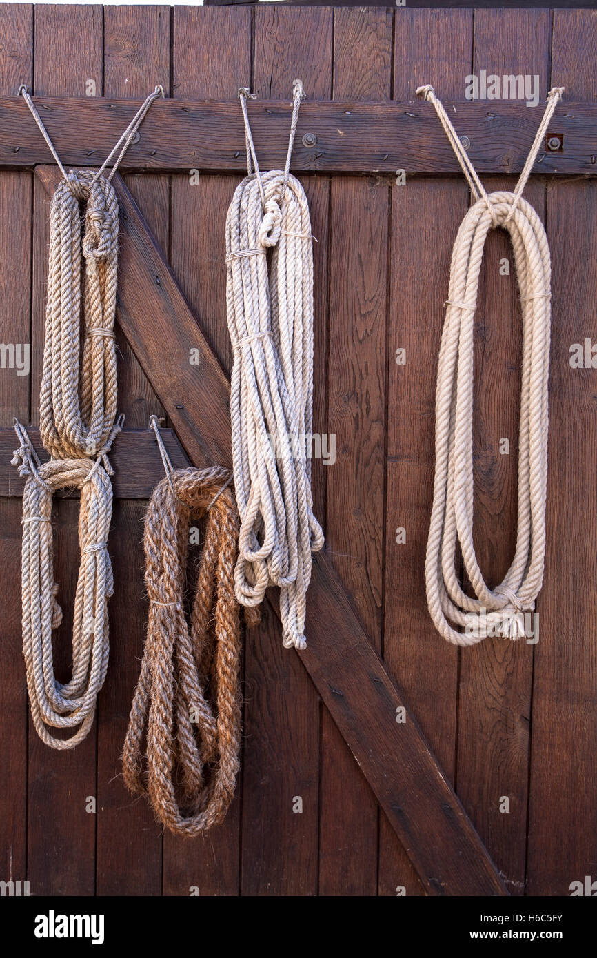 Germany, Hagen, Hagen Open-air Museum, ropes hanging on the door of the old ropery. Stock Photo