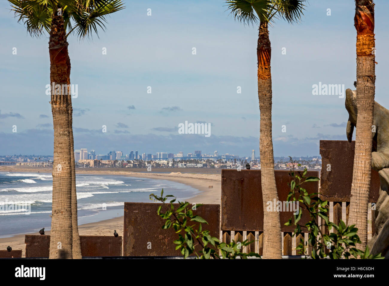 Tijuana, Mexico - The U.S.-Mexico border fence where it meets the Pacific Ocean. San Diego, California is up the beach. Stock Photo
