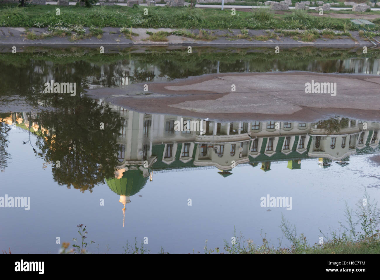 reflection of a mansion on the puddle Stock Photo - Alamy