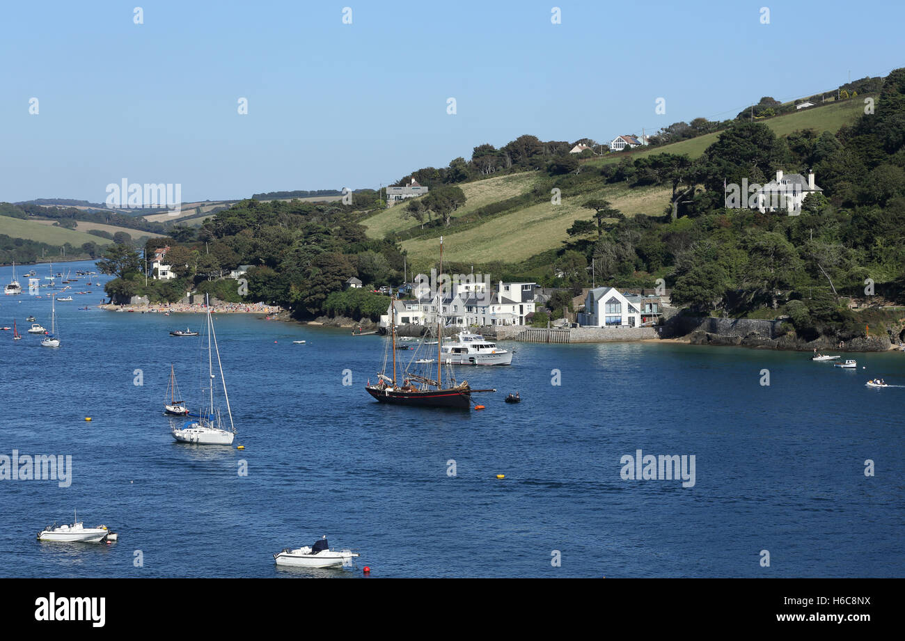 A sailing boat moored in the harbour at Salcombe in Devon Stock Photo