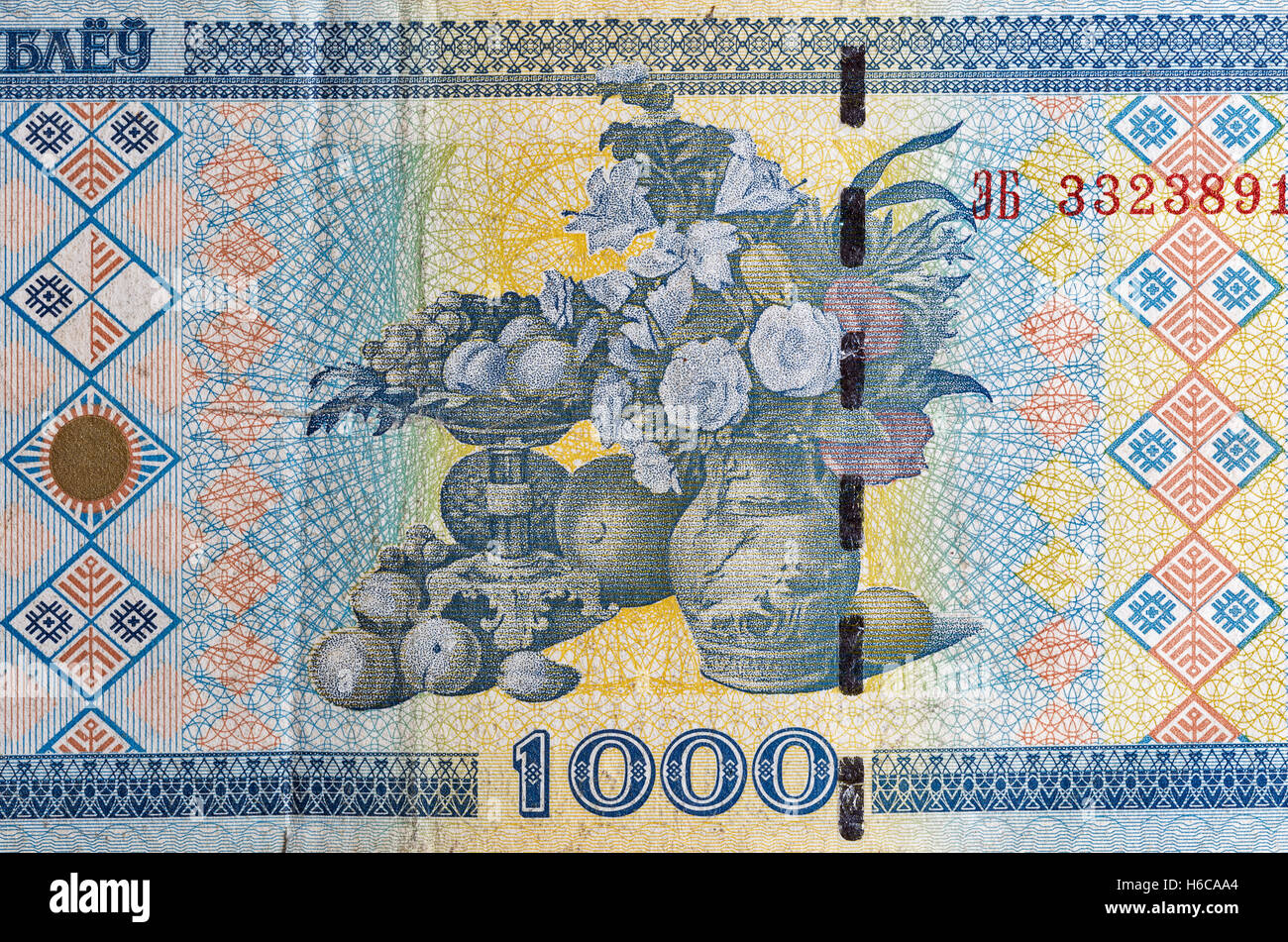 used 1000 ruble old bill of Belarus fragment macro with the fragment of the picture Portrait of the wife with flowers and fruits Stock Photo
