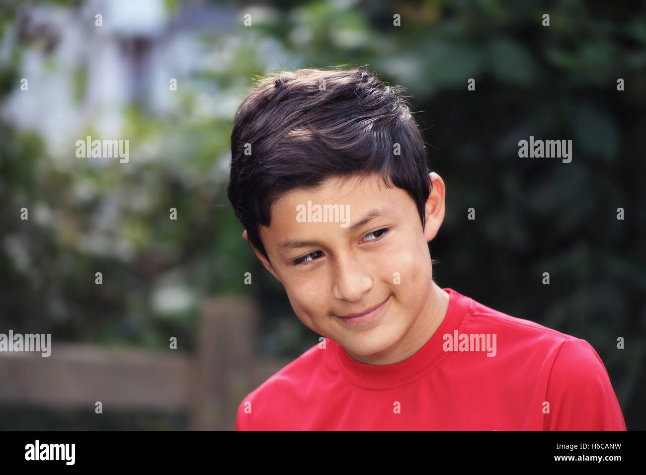 Portrait of smiling Hispanic young boy - taken with vintage lens Stock Photo