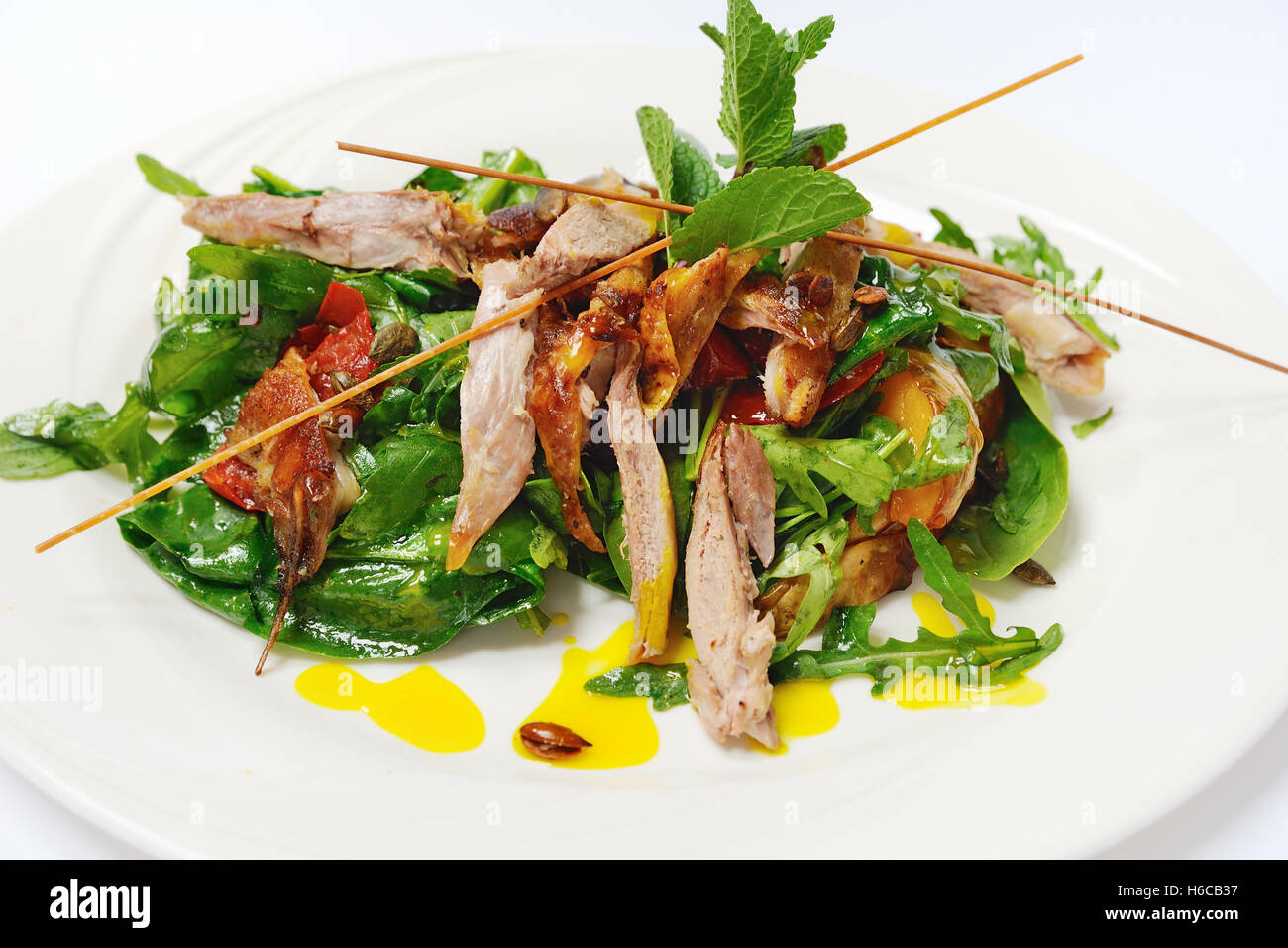 Pumpkin salad with crispy duck and greens Stock Photo