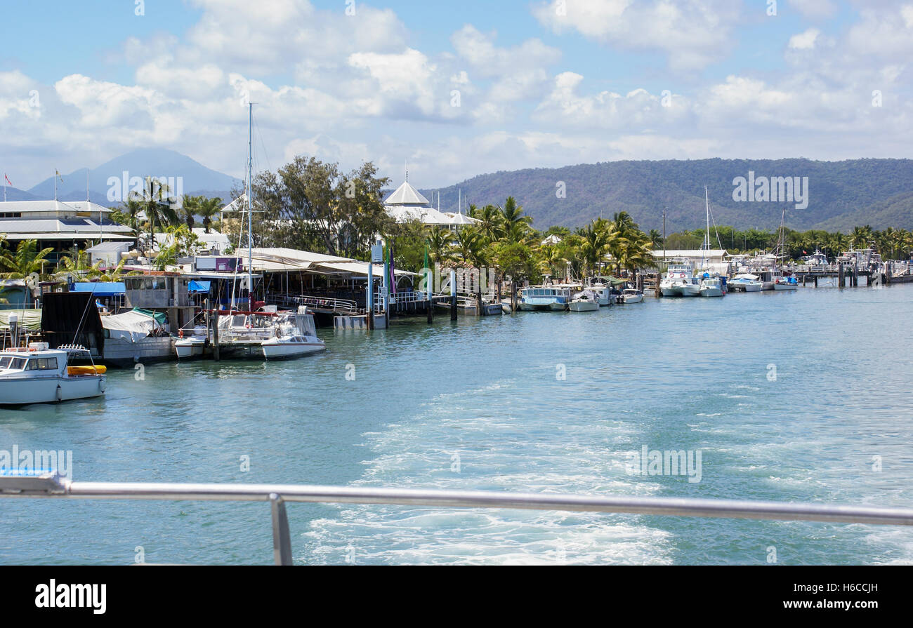 Boat leaving harbour at tropical Port Douglas, Australia Stock Photo