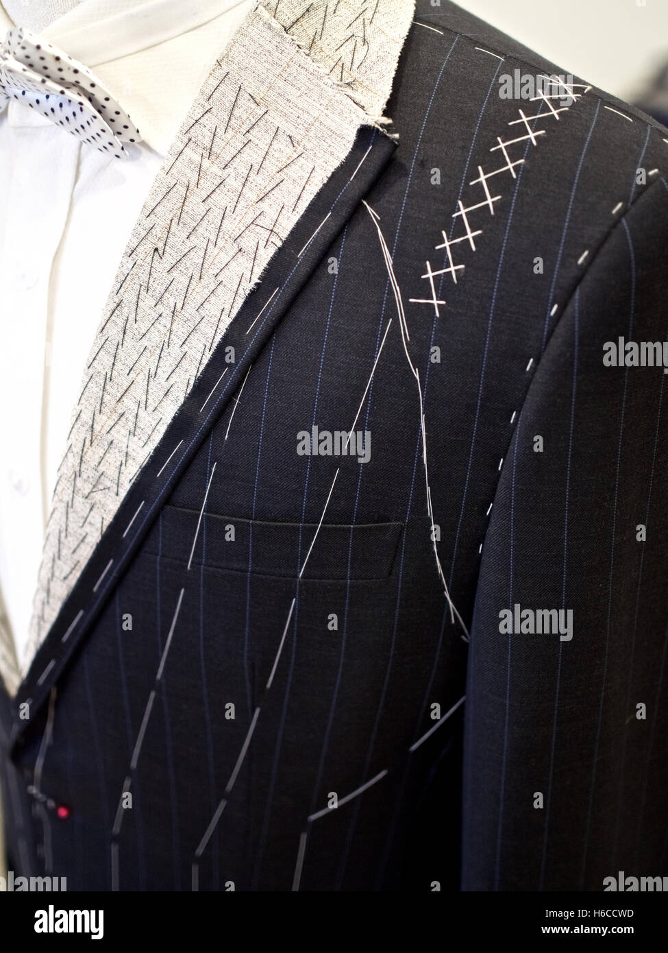 Suit tailor fabrication stitching fabric custom Stock Photo Alamy