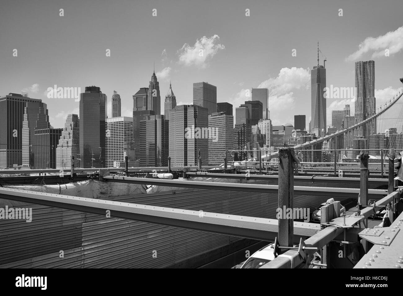 View from historic Brooklyn Bridge to  New York City, New York, USA. Black and White Image Stock Photo