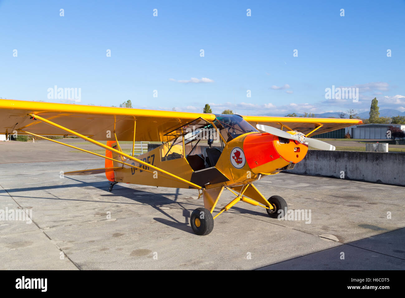 Bremgarten, Germany - October 22, 2016: A classic yellow Piper Cub aircraft parked at the airport Stock Photo