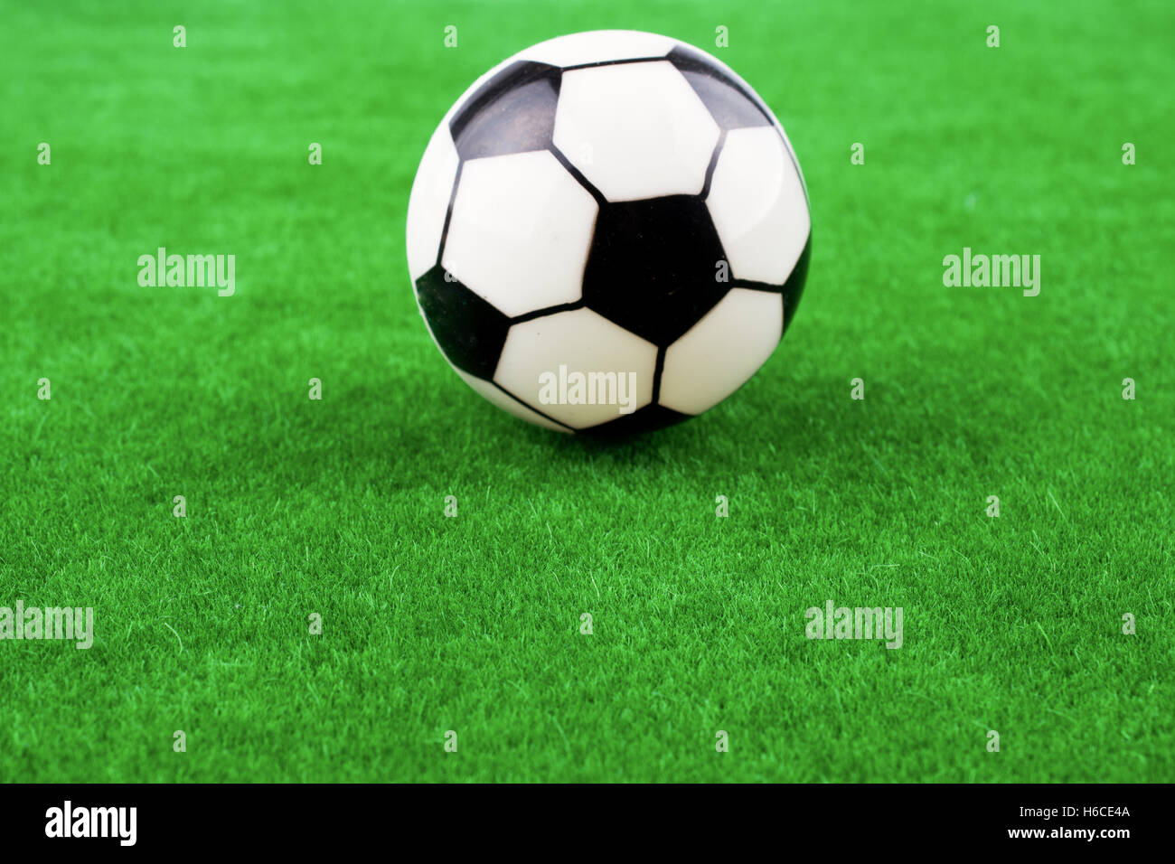 Fake soccer ball on a fake green grass field Stock Photo Alamy