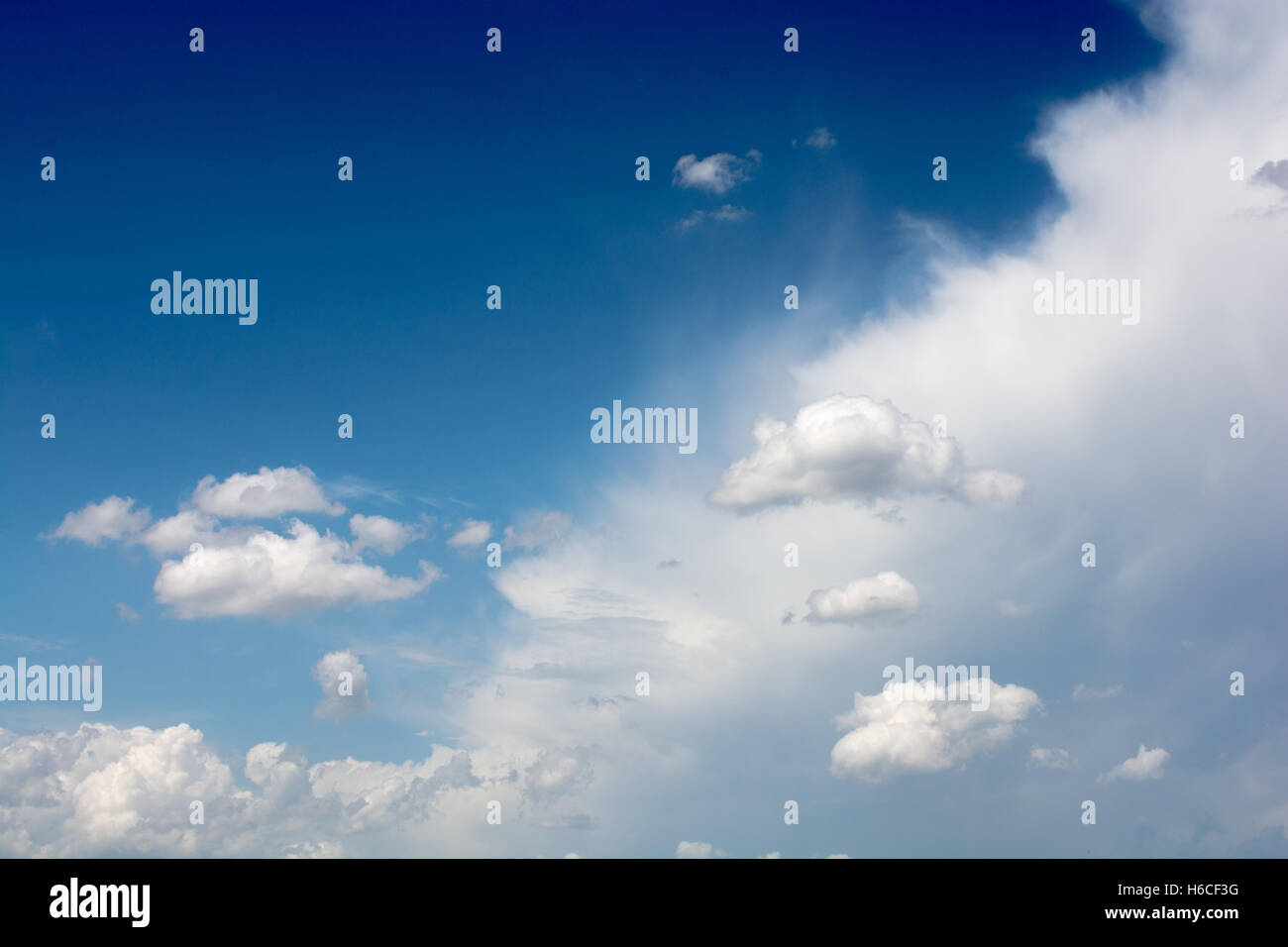 Blue cloudy sky with white and grey clouds Stock Photo Alamy
