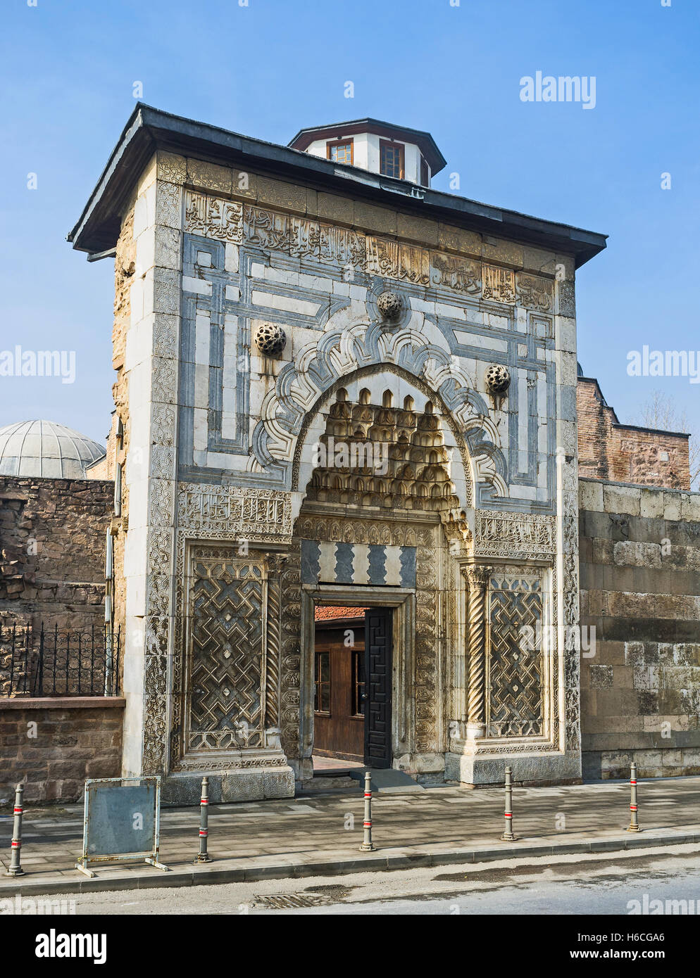 The carved stone gates of Karatay Madrasah decorated with geometric patterns in islamic style, Konya, Turkey. Stock Photo