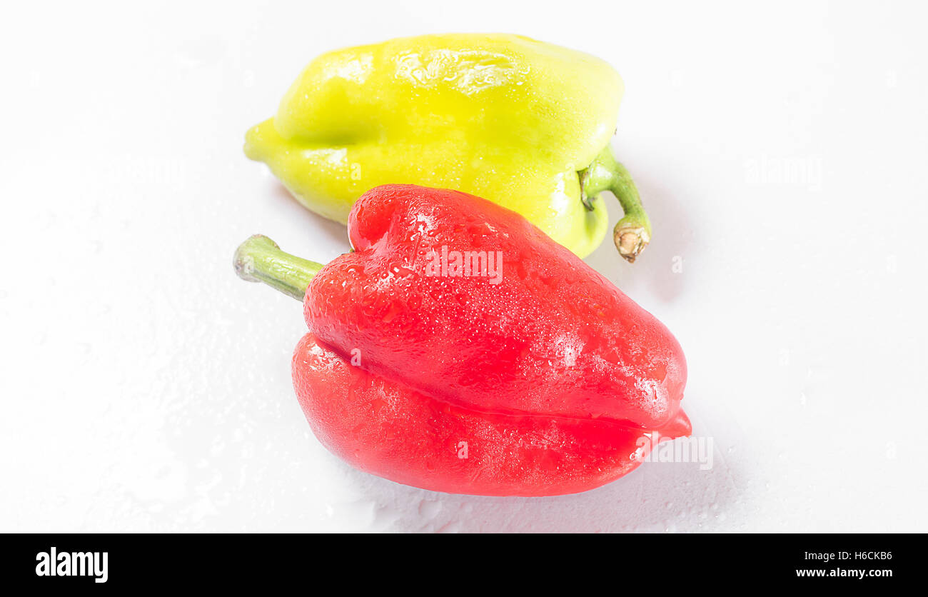 Two peppers green and red Stock Photo - Alamy