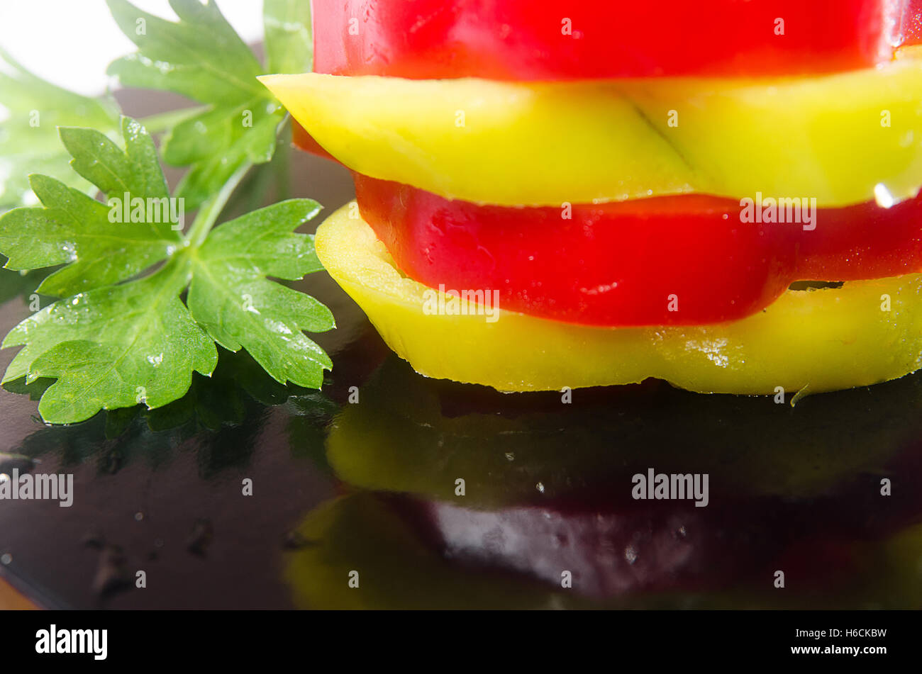 Sliced red and green peppers Stock Photo - Alamy