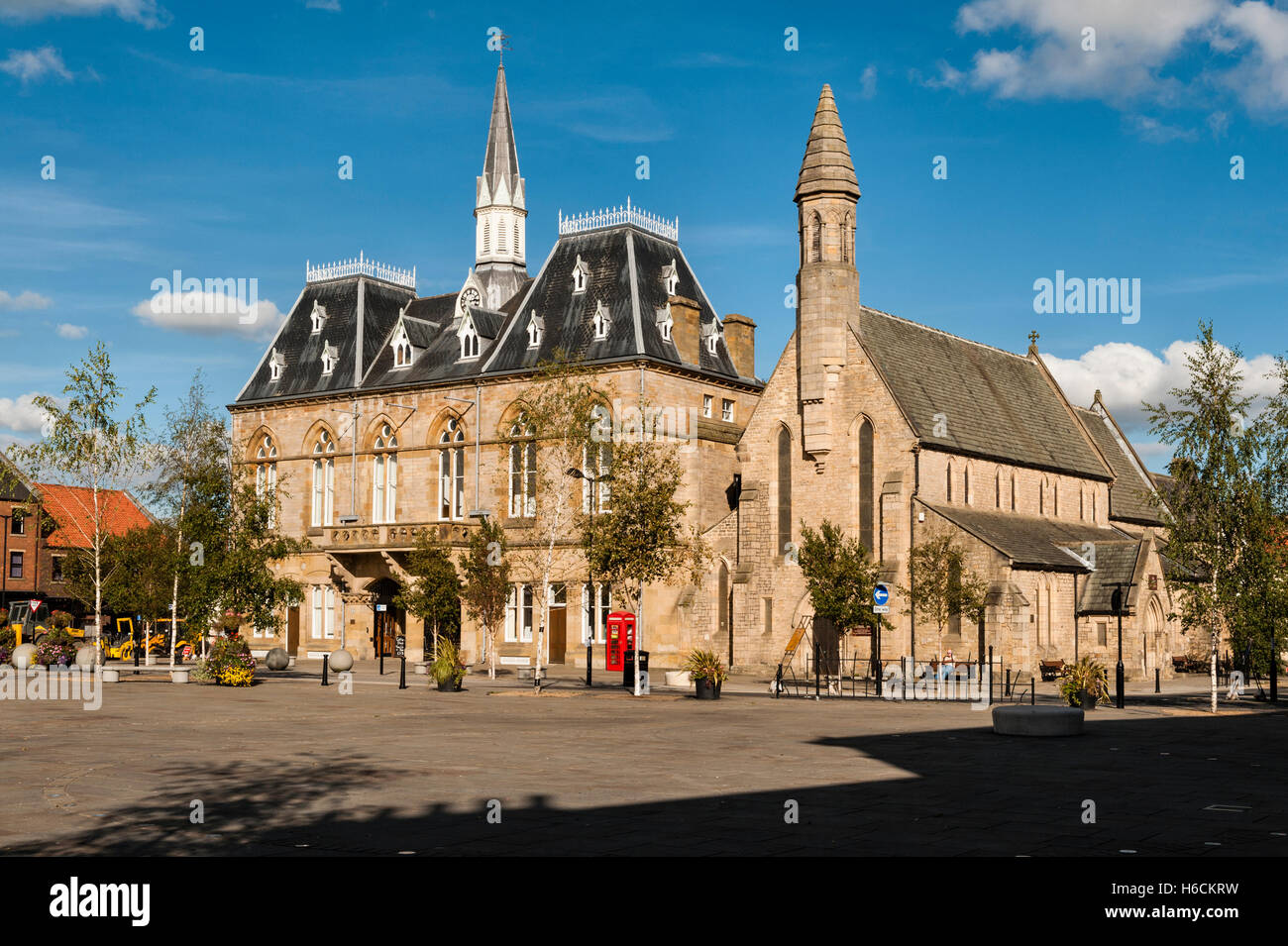Bishop Auckland, County Durham, UK. The Victorian Gothic town hall in the market place, containing the library and a theatre Stock Photo