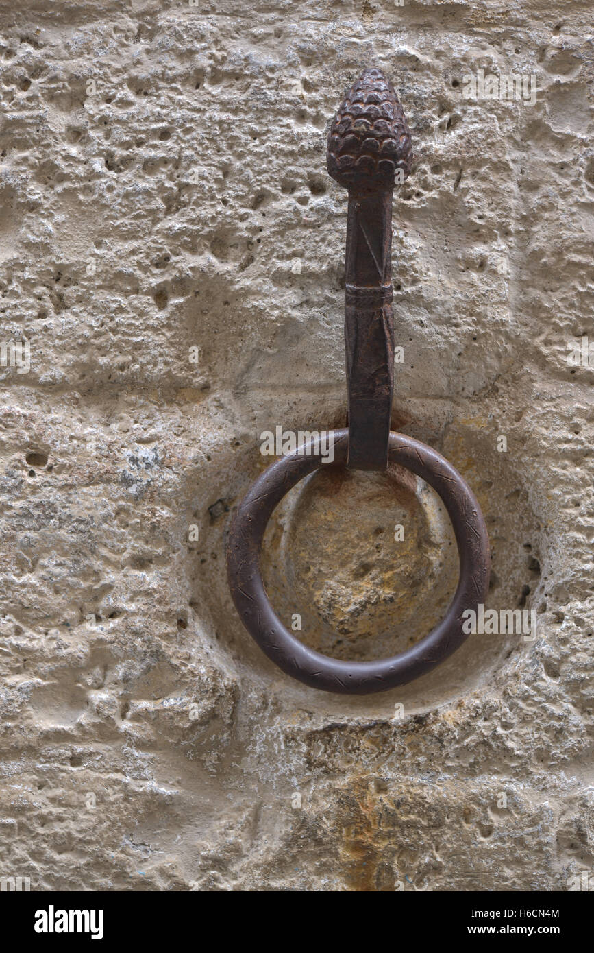 Outdoor old horse hitching ring on a historical wall Stock Photo
