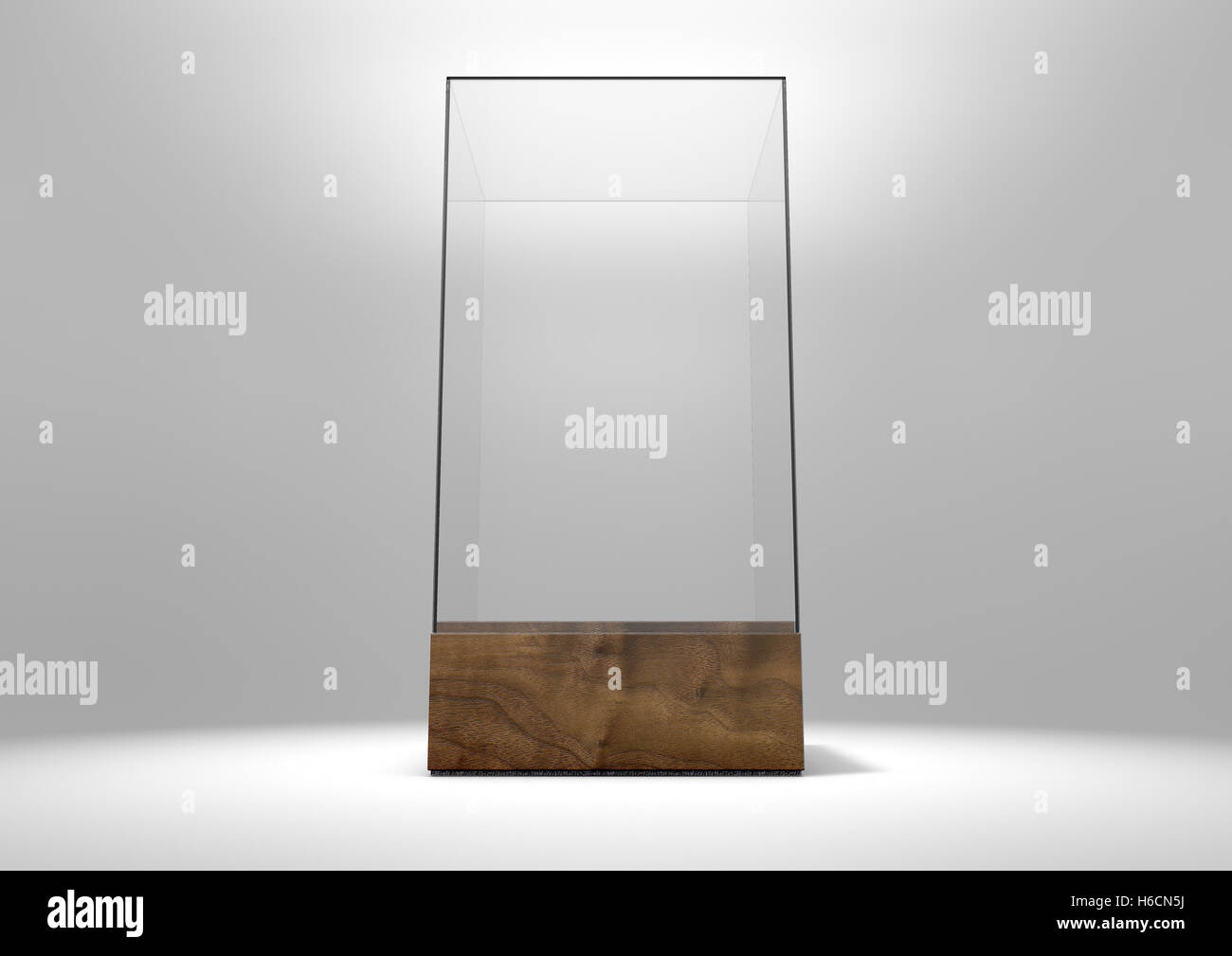 A 3D rendering of an empty glass display case  with a wooden base on an isolated white studio background Stock Photo