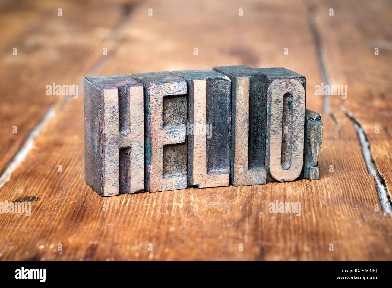 hello exclamation made from wooden letterpress type on grunge wood Stock Photo