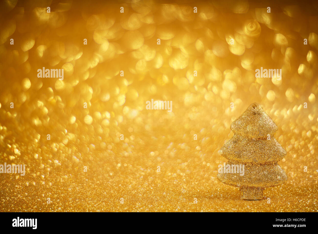 Golden christmas fir tree decoration on glitter background Stock Photo ...