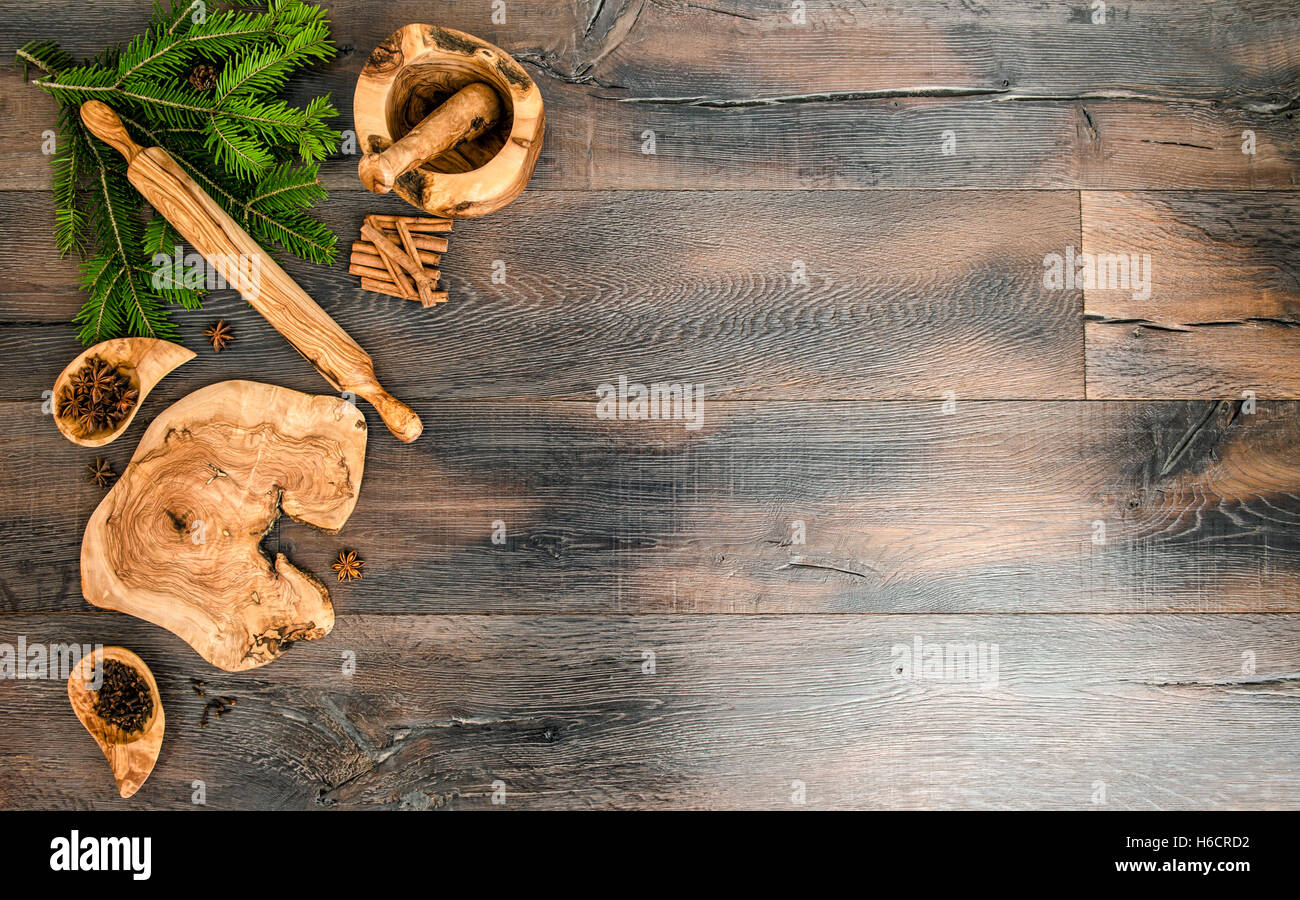 Christmas tree branches with spices and baking tools. Holidays food background Stock Photo