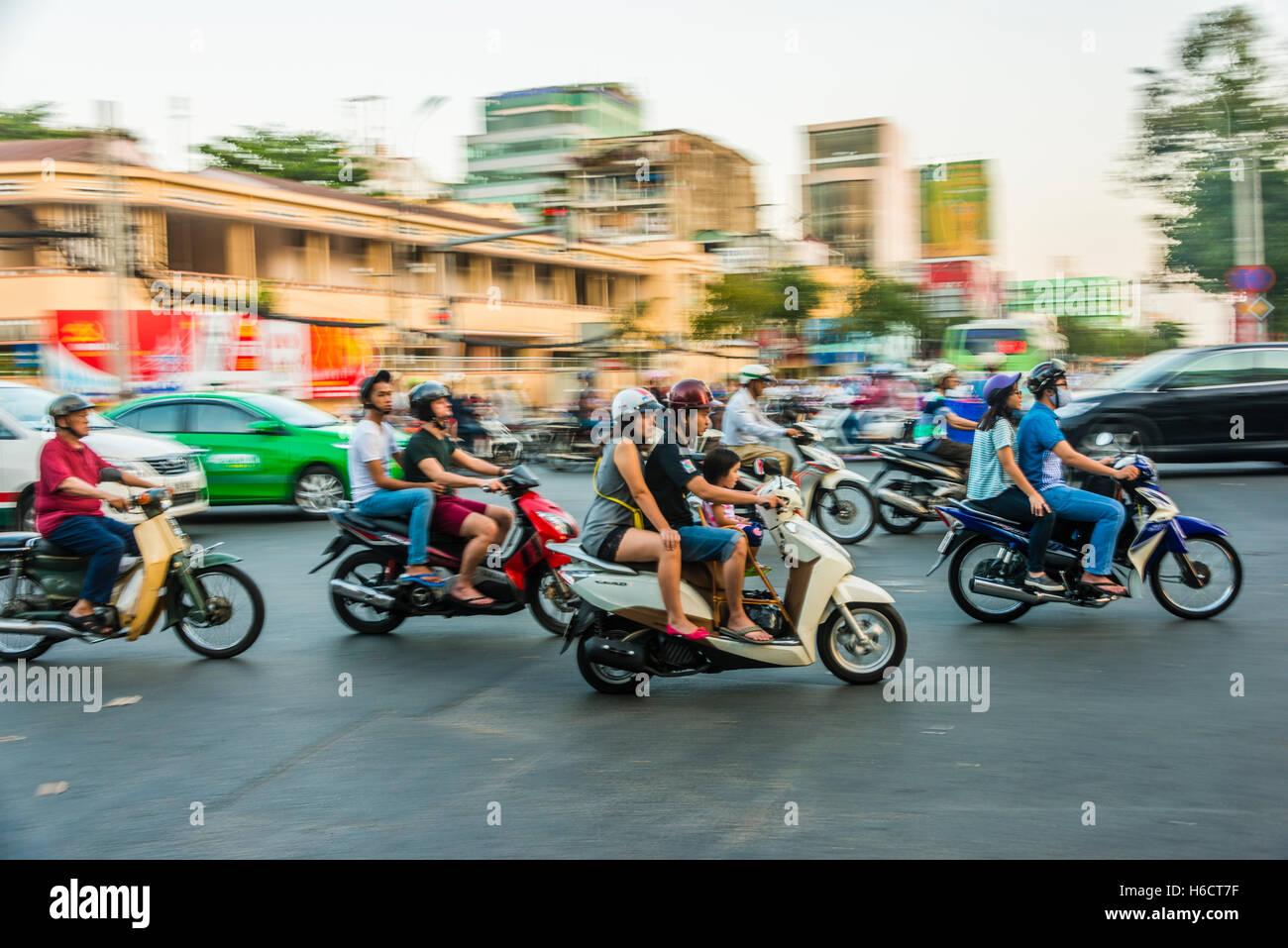 Scooter drivers in heavy traffic, motion blur, Ho Chi Minh City, Vietnam Stock Photo