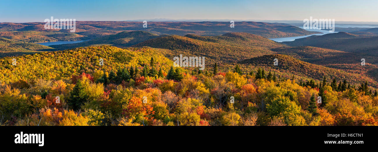 Colorful Autumn panoramic view south over the Great Sacandaga Lake from the Hadley Mountain fire tower in the Adirondacks Stock Photo