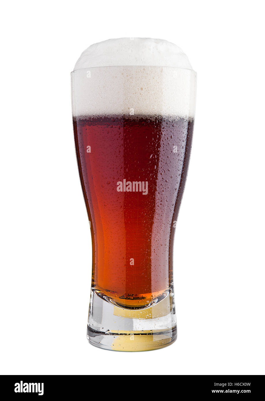 Glass of brown ale beer with foam on white background Stock Photo
