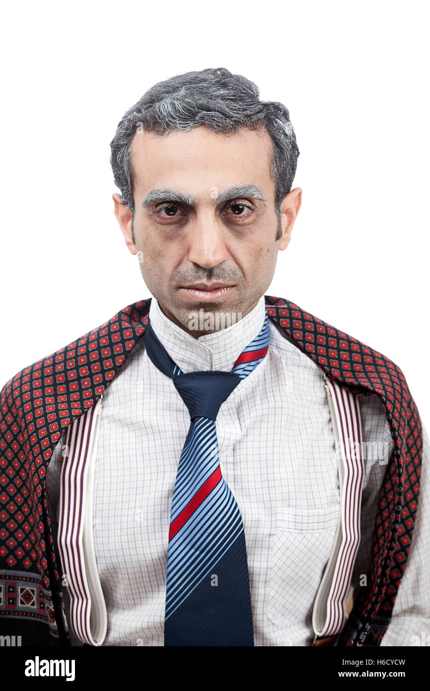 Studio portrait of an adult man (mid 30's) wearing old-man clothes and makeup, and giving an alluring look full with sexual inte Stock Photo