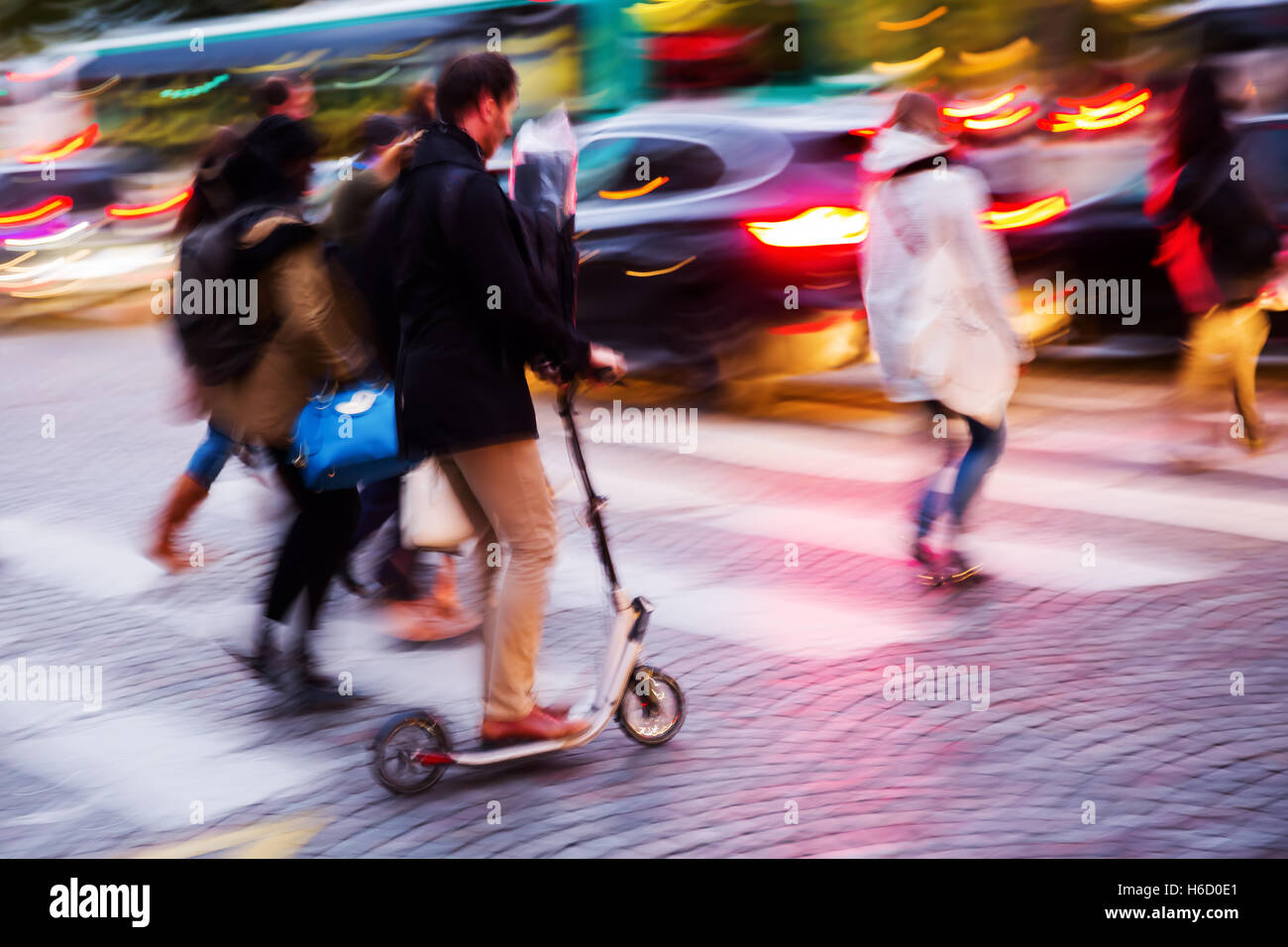 picture in motion blur of people crossing a city street at night Stock ...