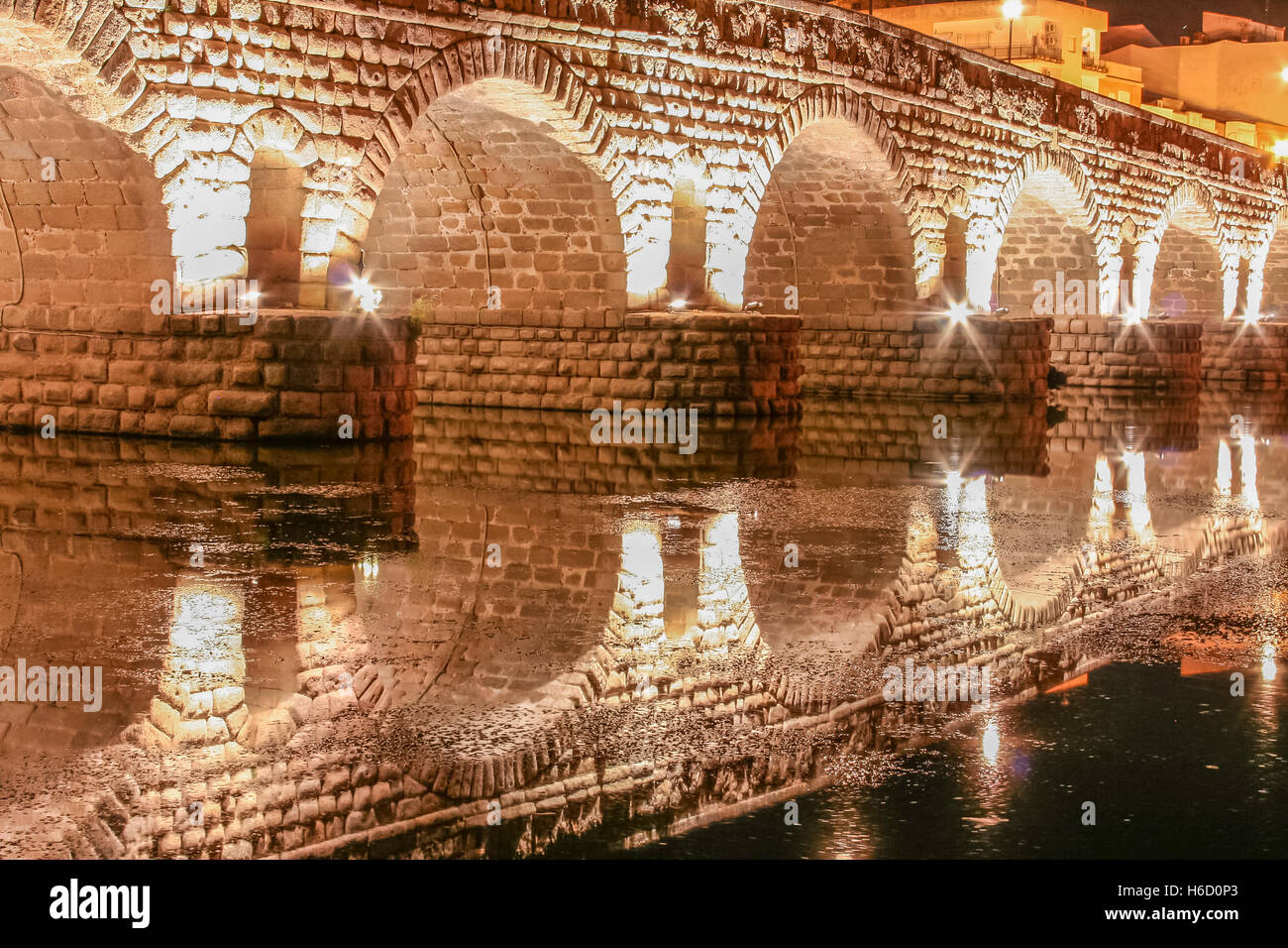 Roman bridge over Guadiana River at night, Merida, Spain Stock Photo