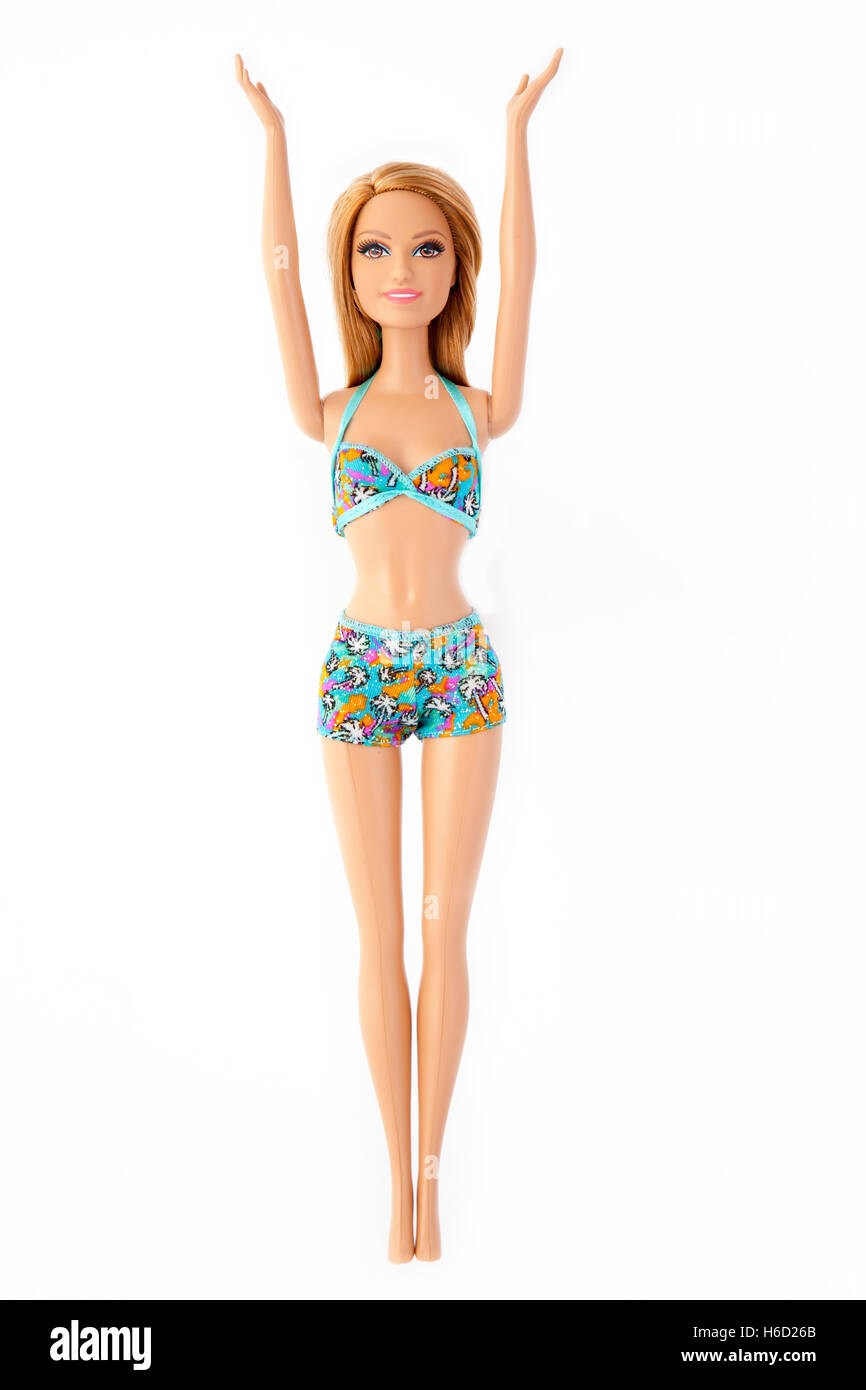 Barbie doll with both arms raised wearing bikini swimming costume. Cut out. Stock Photo