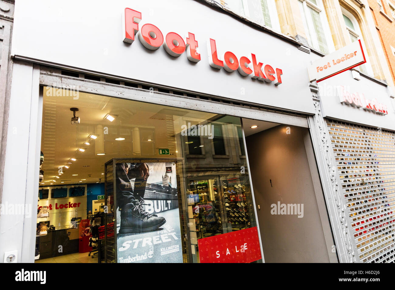 Foot locker store shop front sign exterior high street chain store shoe shop signs window sale display UK England GB Stock Photo
