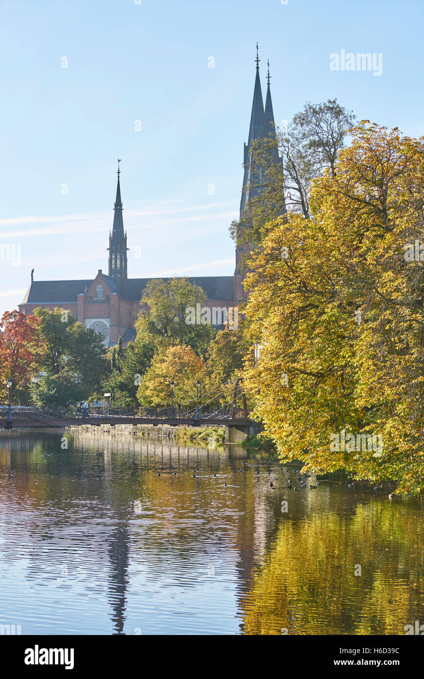 The Cathedral and the Fyris river in the autumn with the Jernbron (Iron Bridge) in the foreground, Uppsala, Sweden, Scandinavia Stock Photo