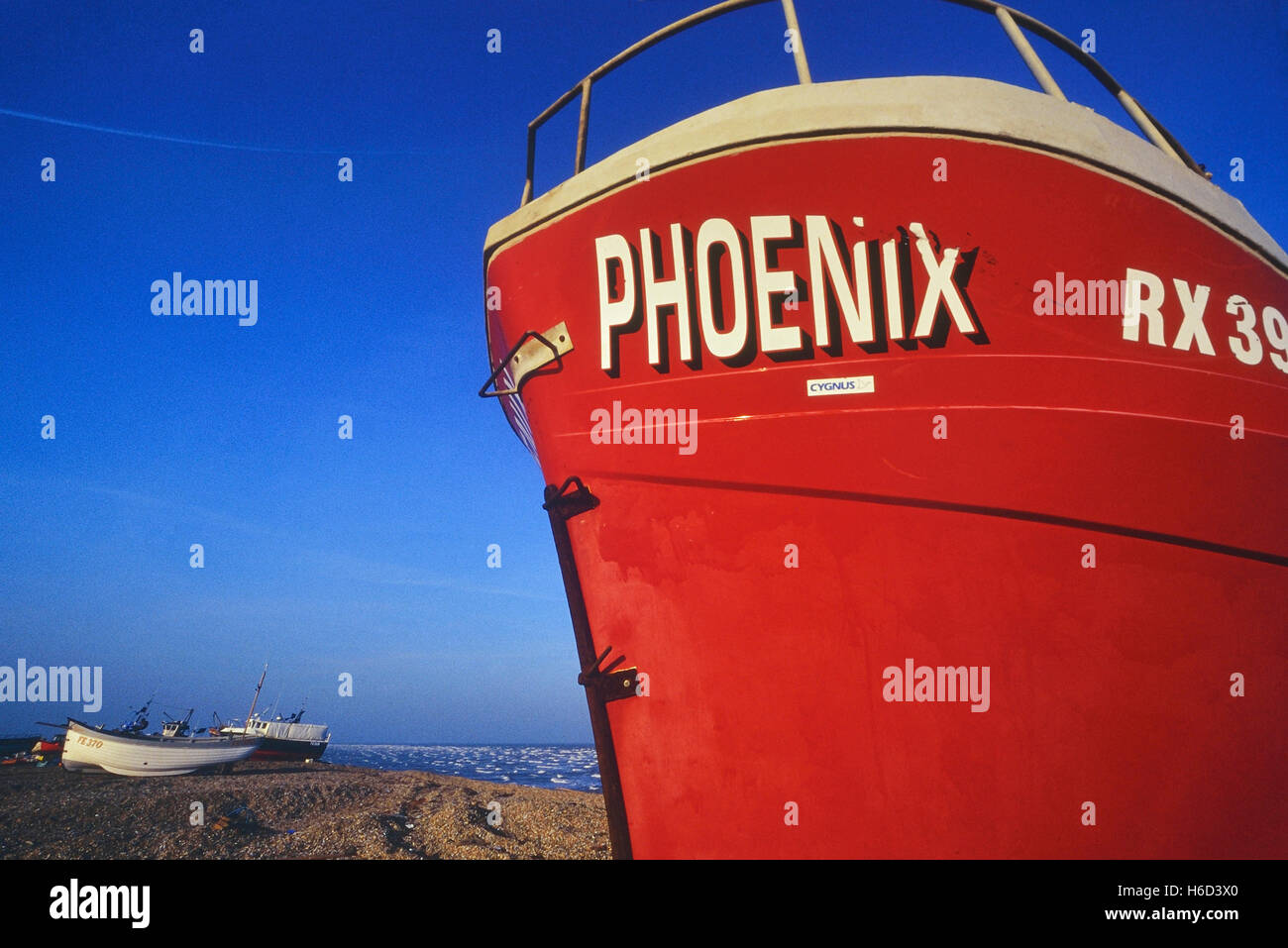 Commercial fishing boats moored on Dungeness beach. Kent. England. UK Stock Photo