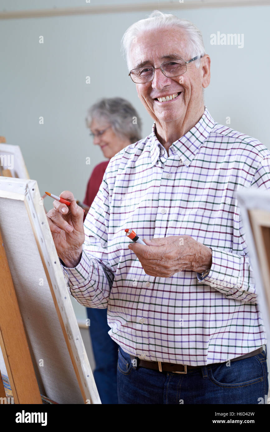 Seniors Attending Painting Class Together Stock Photo