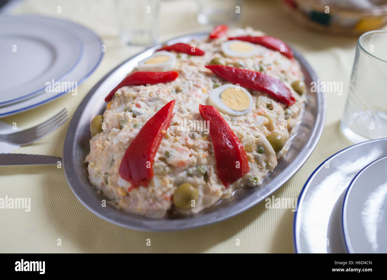 Russian salad on a table, a delicious meal. Stock Photo
