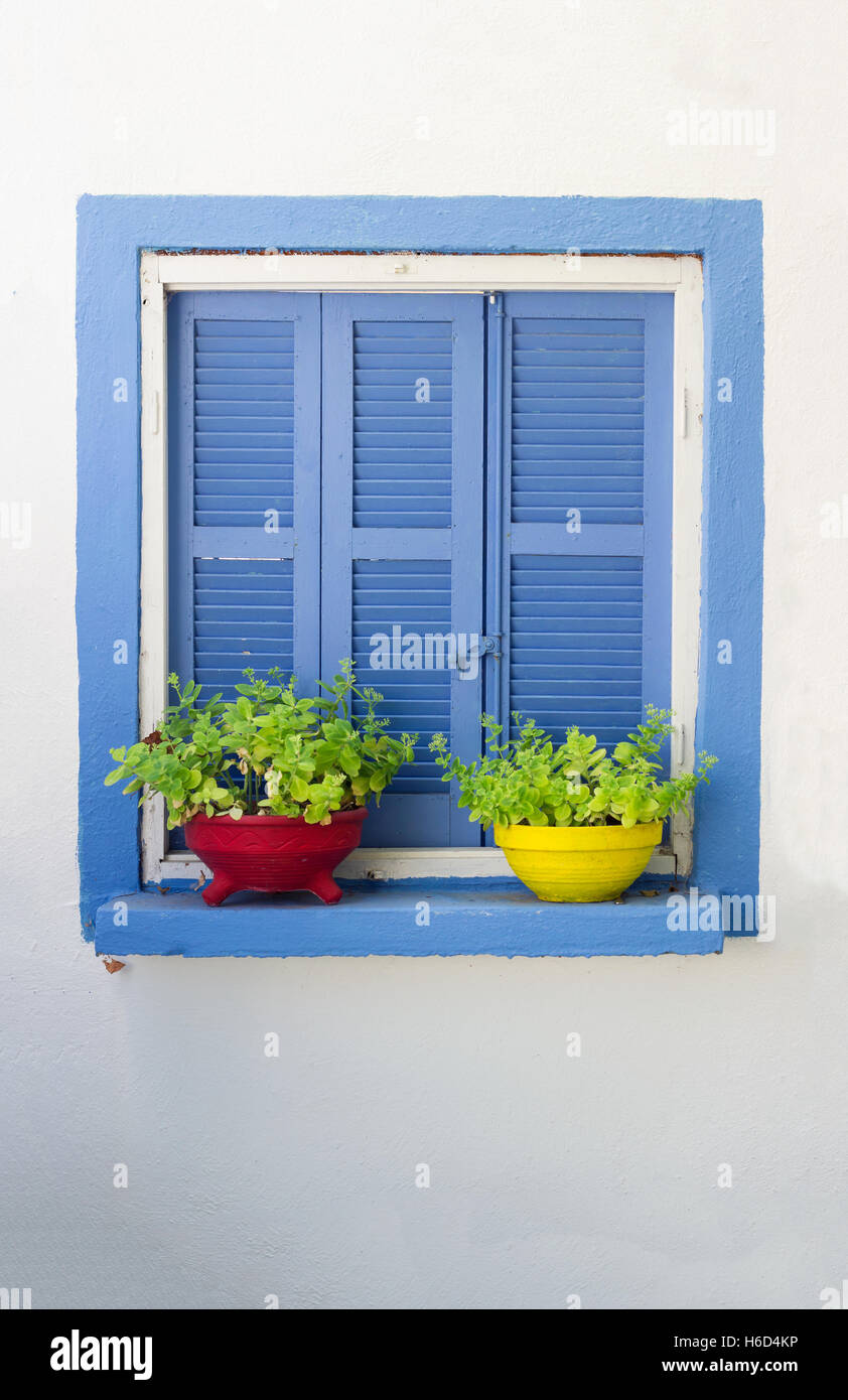 Blue window sill with flowerpots Stock Photo