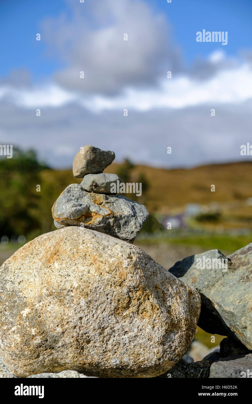 A stack of rocks and stones balancing make a cairn in Isle of Skye Scotland Stock Photo