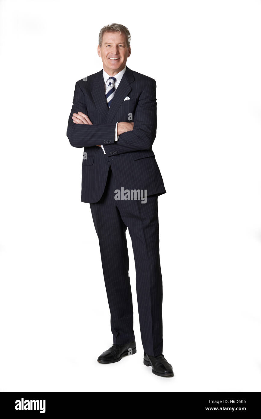 Portrait Of Mature Businessman With Crossed Arms Stock Photo