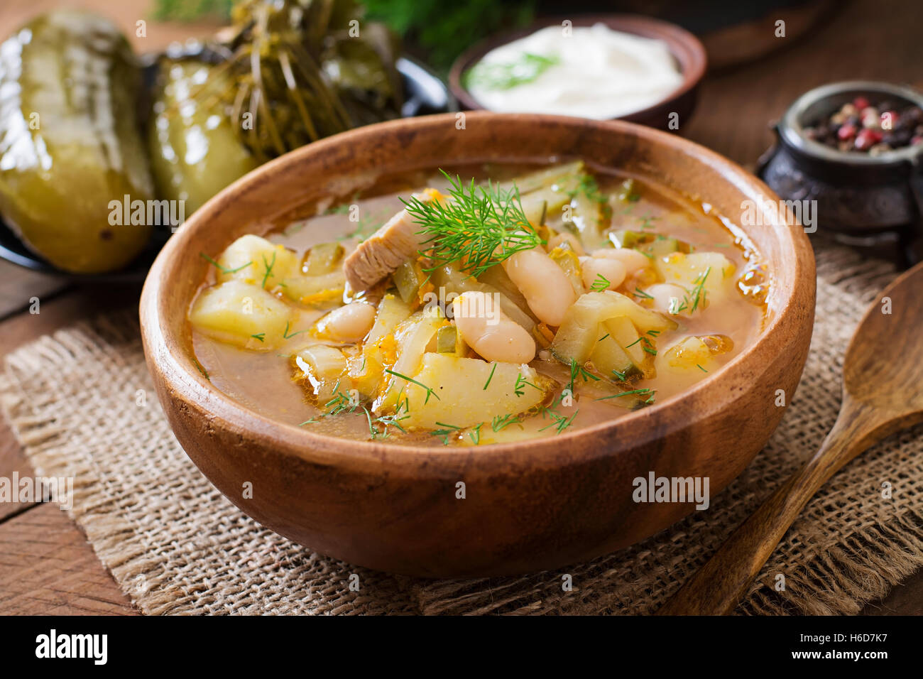 Soup with pickled cucumbers and beans in Ukrainian style Stock Photo