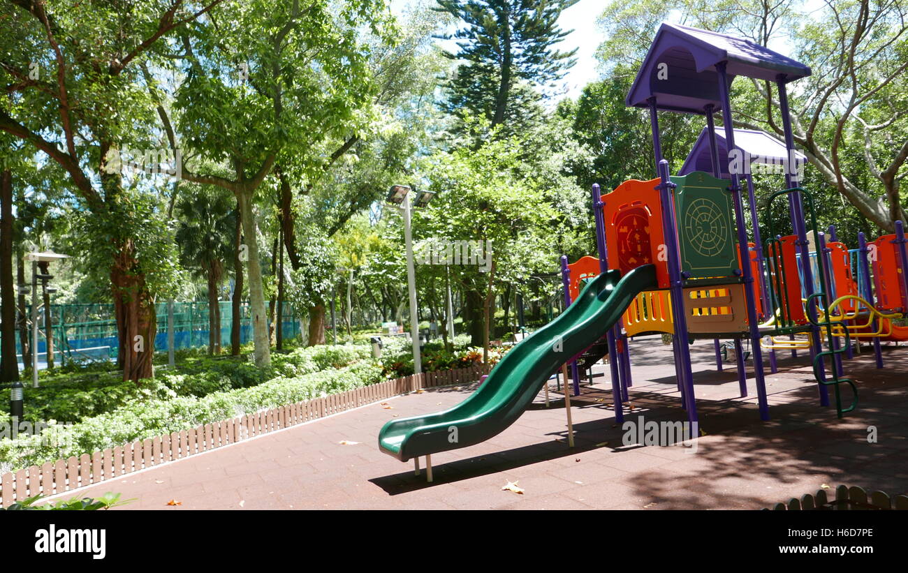 Colourful outdoor playground slider kid equipment Stock Photo