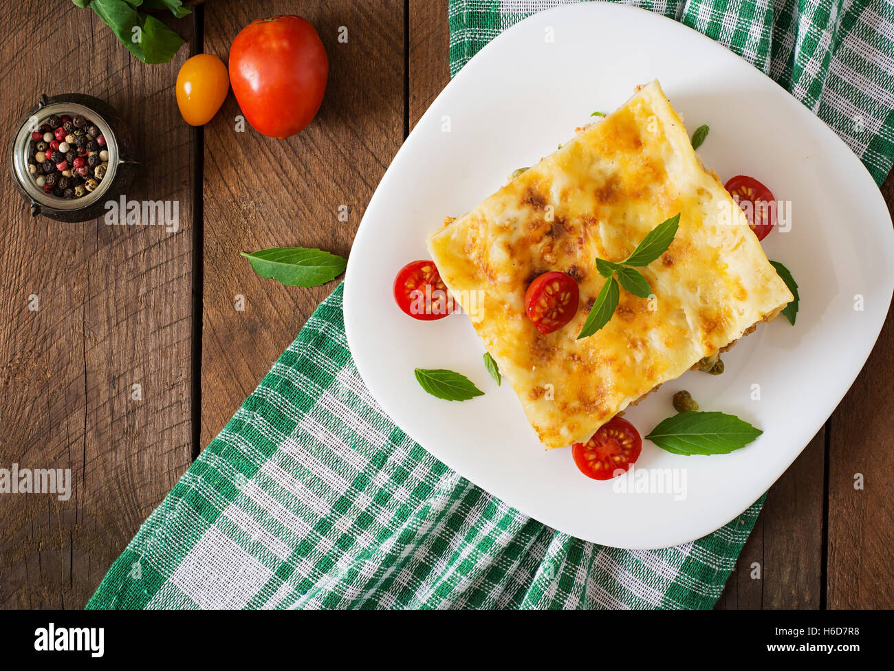 Lasagna with minced meat, green peas and sauce. Top view Stock Photo ...
