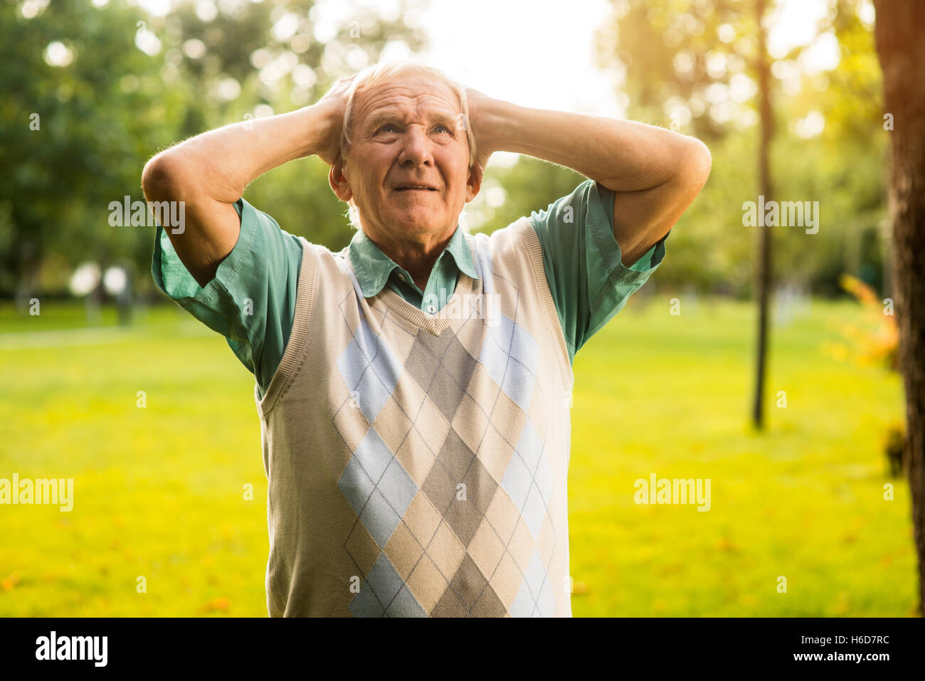 Man holding head in despair. Stock Photo