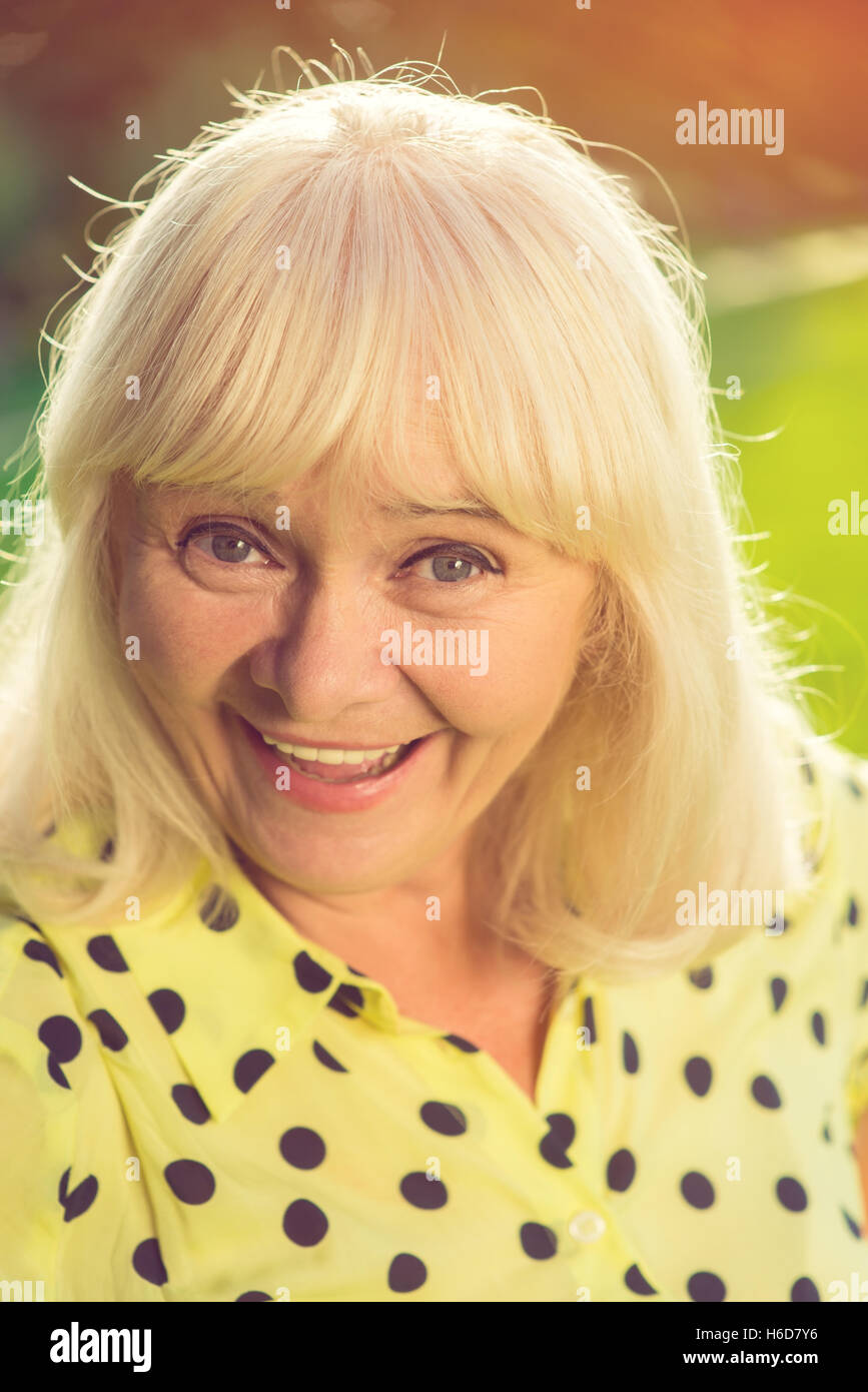 Senior woman smiling at camera. Stock Photo