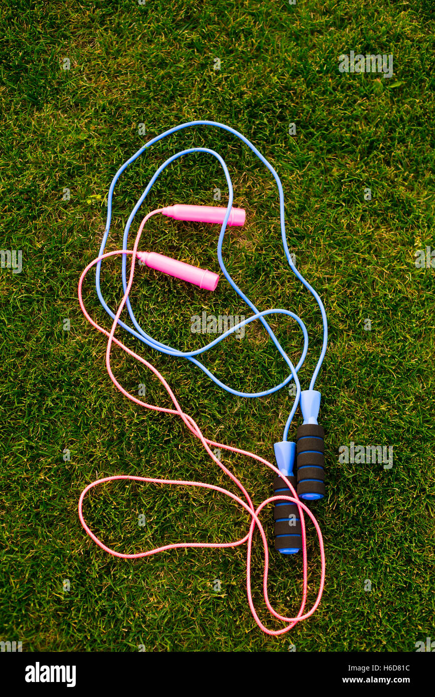 Jump ropes on grass Stock Photo Alamy
