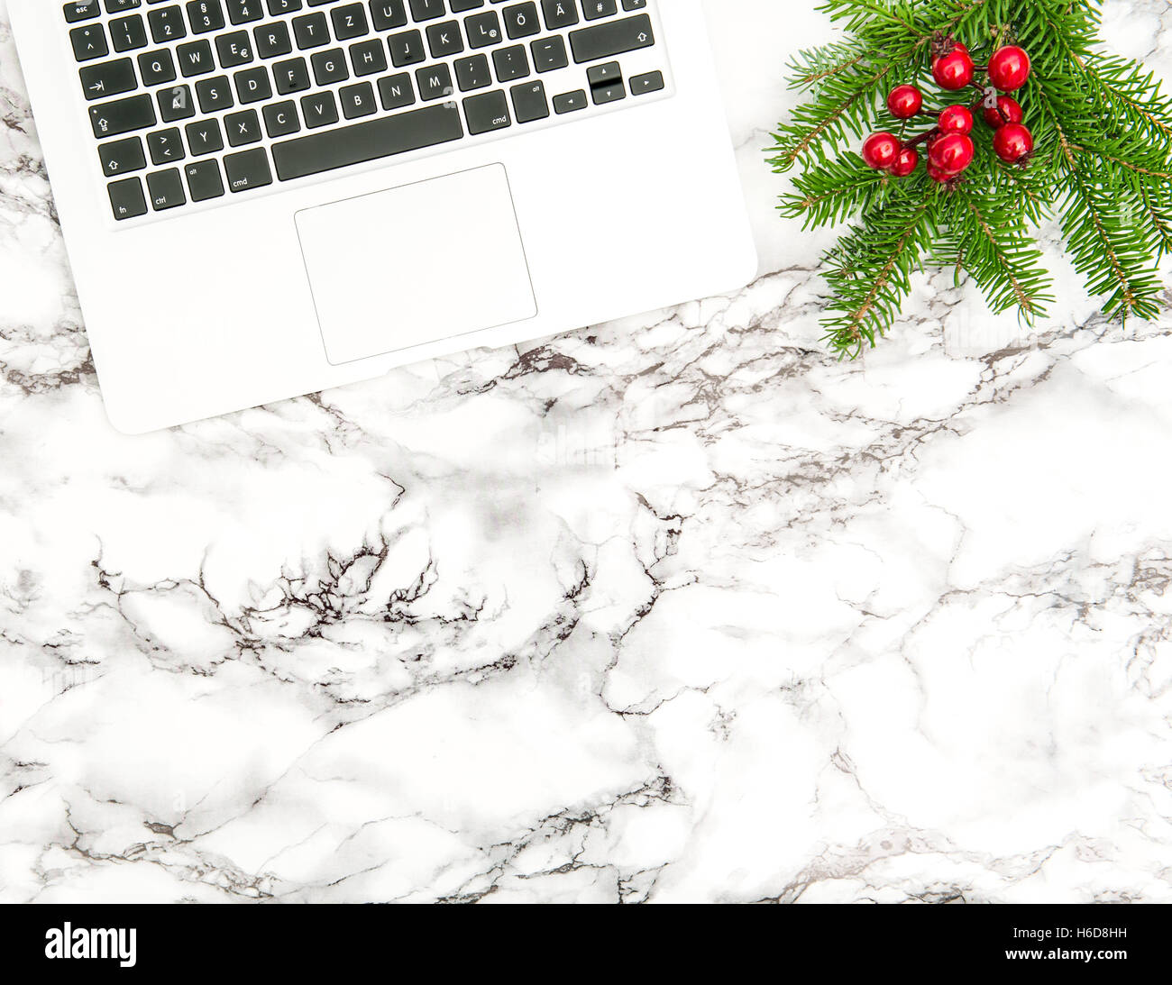 Notebook and Christmas Decoration. Business Holidays Office desk. Flat lay Stock Photo