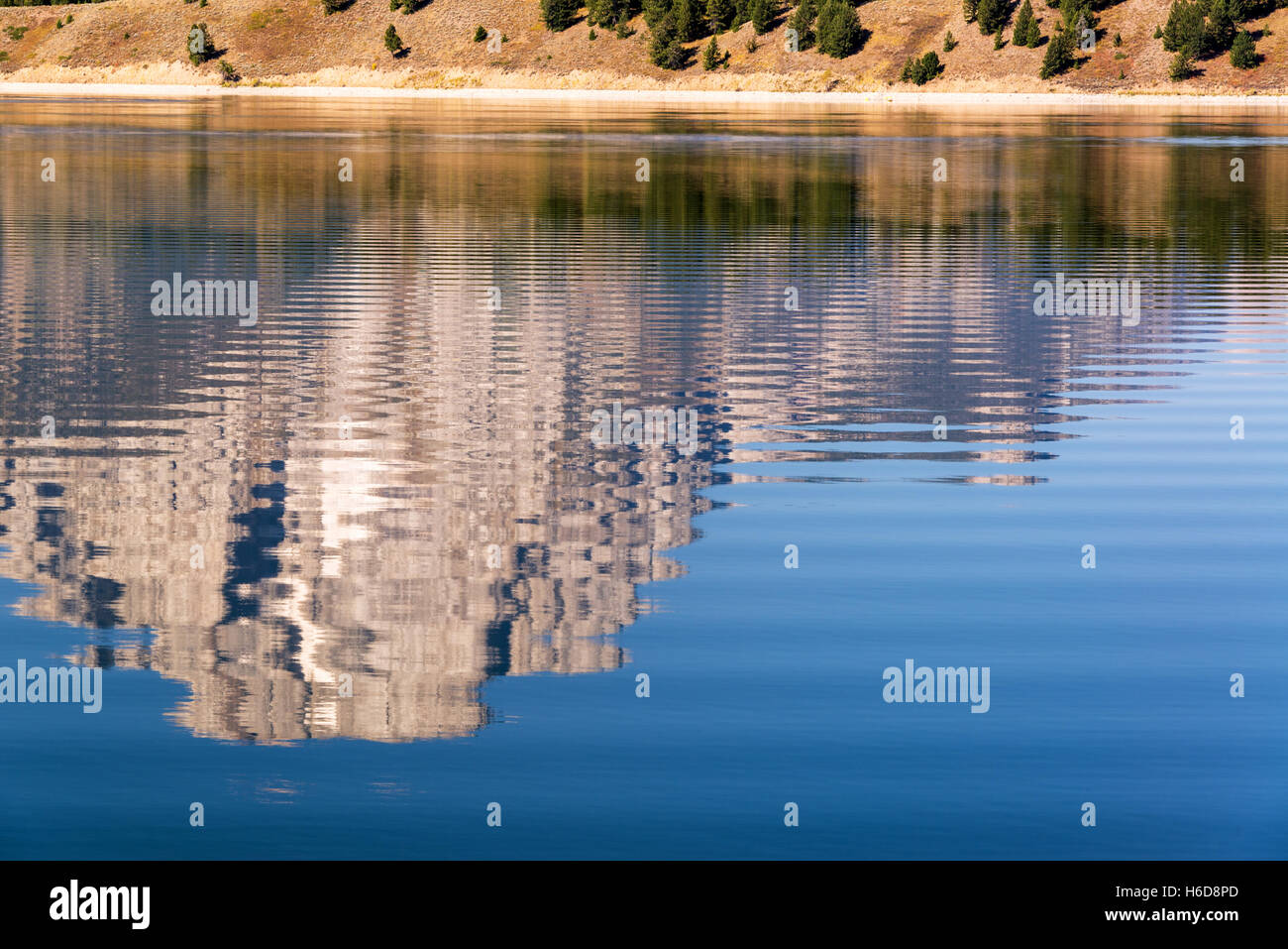 Teton Range reflected in Jackson Lake in Grand Teton National Park in Wyoming Stock Photo